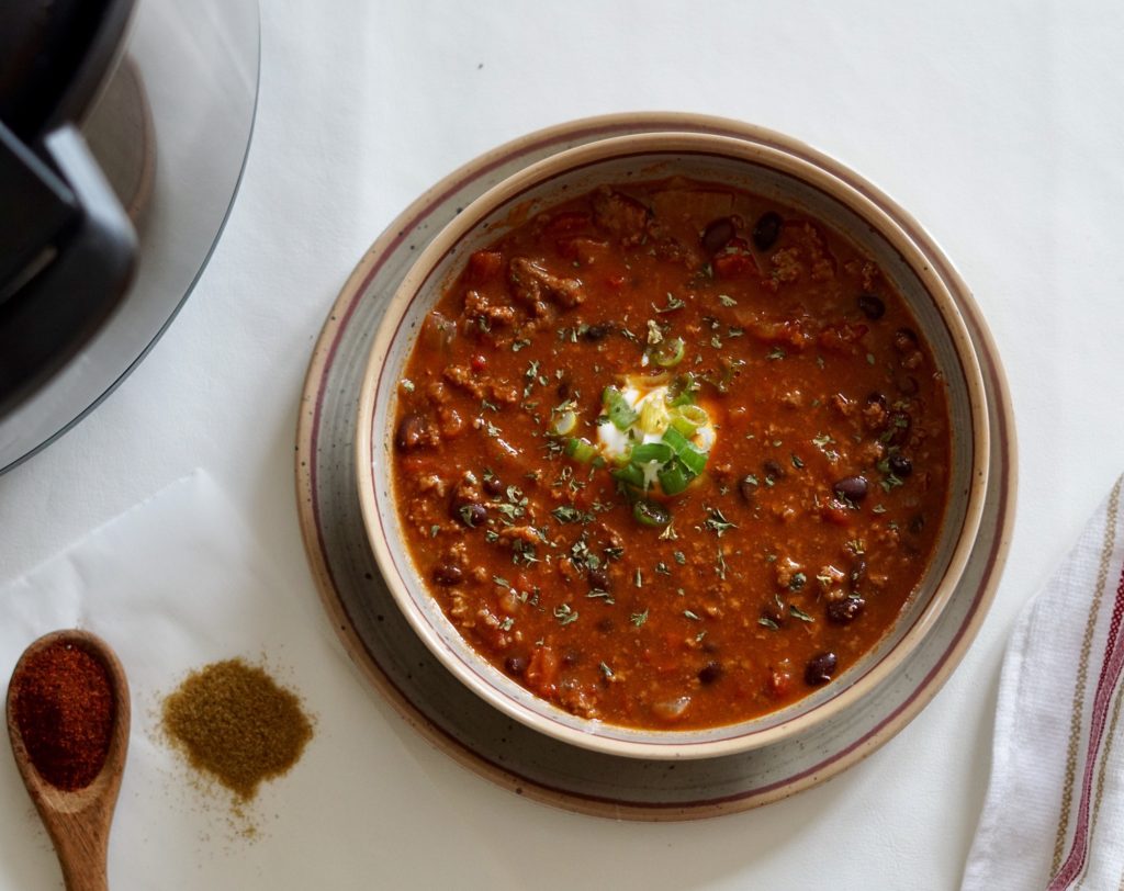 Overhead view of a bowl of chili