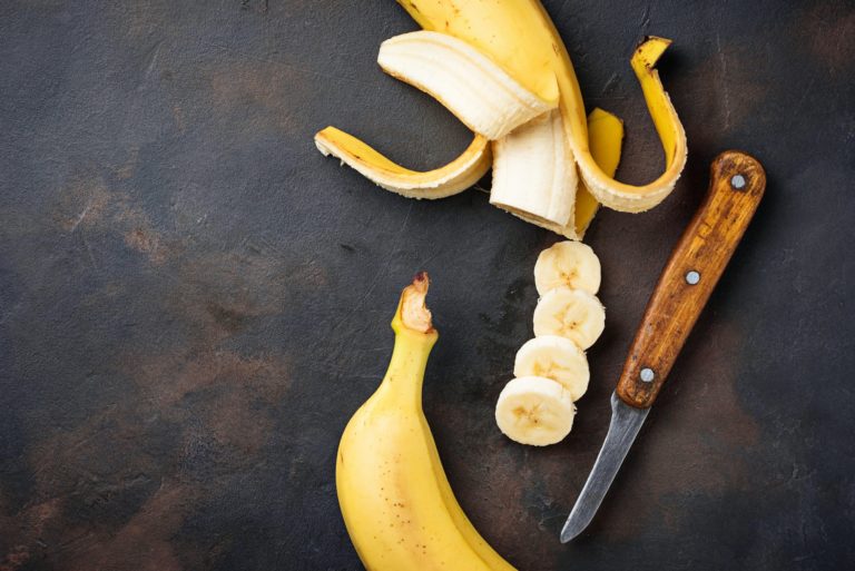 Fresh sliced banana on dark background